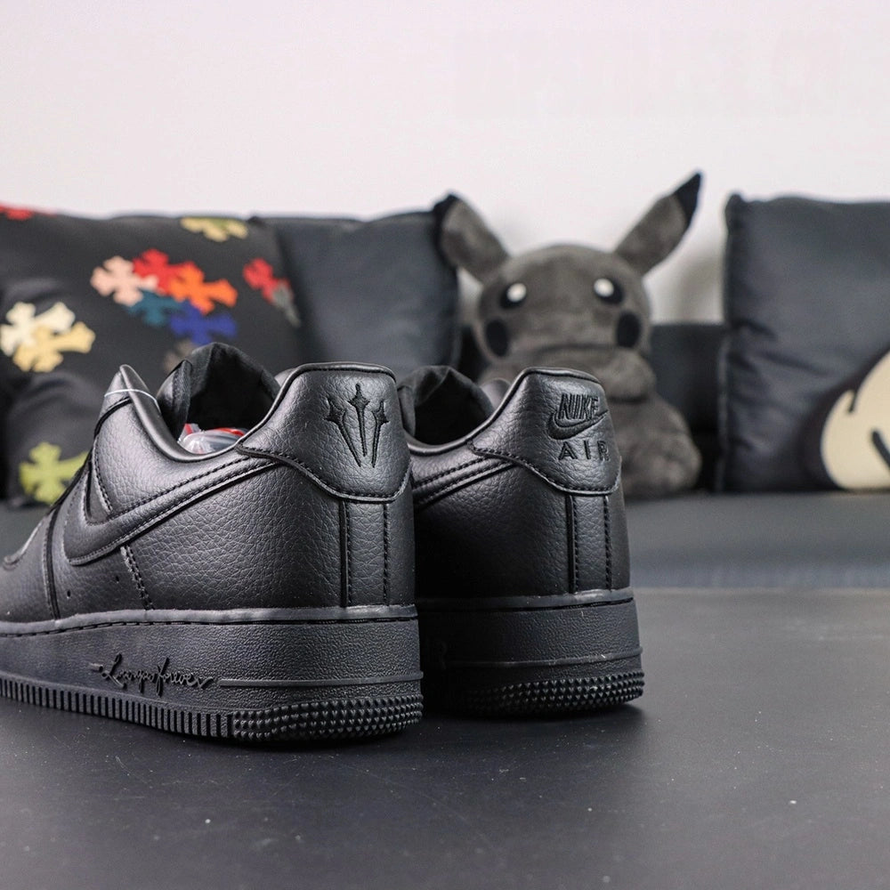 NOCTA x Air Force 1 Low Certified Lover Boy Black - pair three quarter view with Love you Nike box