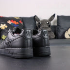 NOCTA x Air Force 1 Low Certified Lover Boy Black - pair three quarter view with Love you Nike box