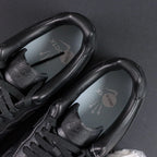 NOCTA x Air Force 1 Low Certified Lover Boy Black - pair overhead flat lay Love you forever midsole
