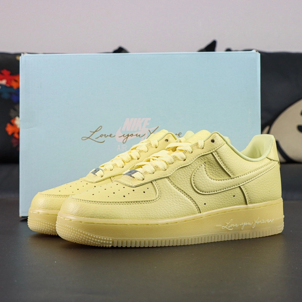 NOCTA x Air Force 1 Low Certified Lover Boy Citron Tint - pair three quarter view Pikachu lifestyle