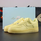NOCTA x Air Force 1 Low Certified Lover Boy Citron Tint - pair three quarter view Pikachu lifestyle