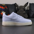NOCTA x Air Force 1 Low Certified Lover Boy Palest Purple - toe box gold AF1 dubrae pair close up