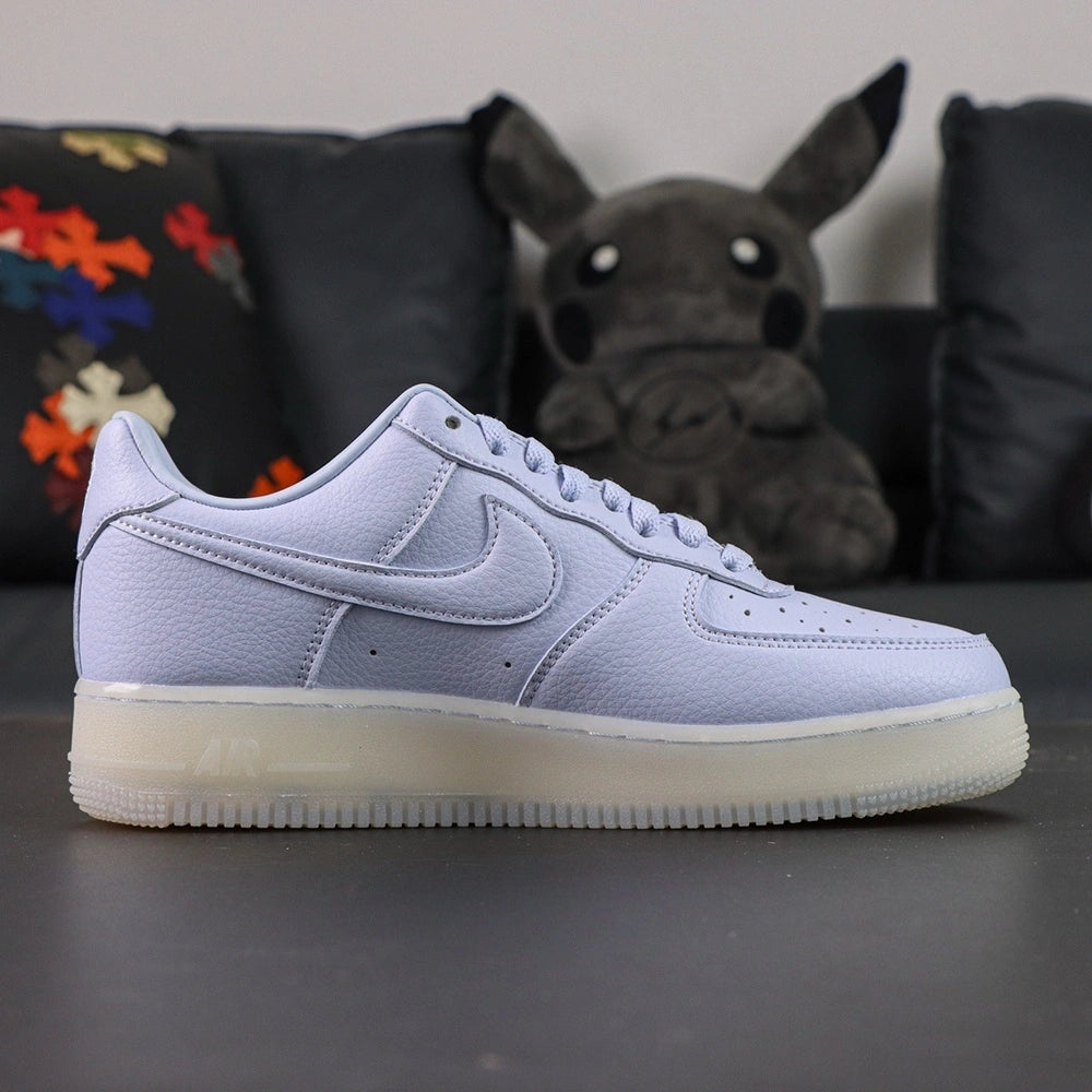 NOCTA x Air Force 1 Low Certified Lover Boy Palest Purple - toe box gold AF1 dubrae pair close up