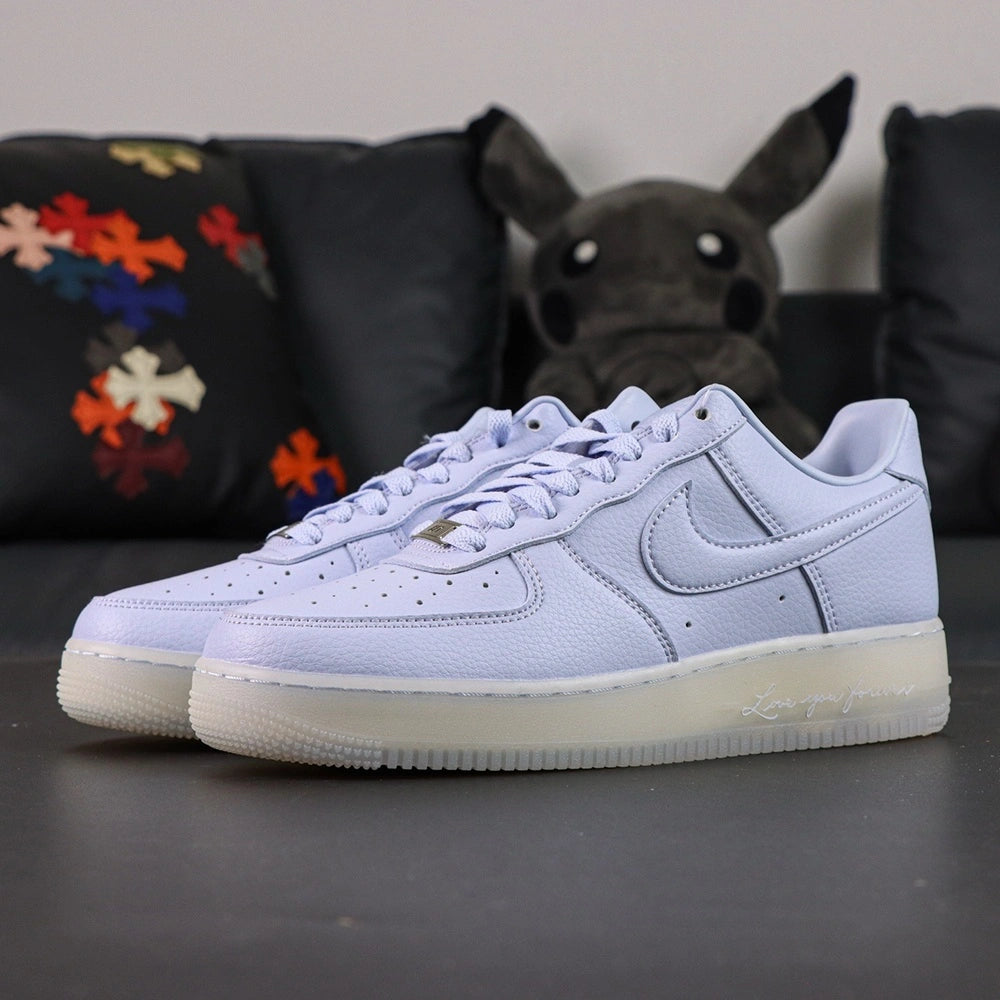 NOCTA x Air Force 1 Low Certified Lover Boy Palest Purple - pair three quarter view icy translucent outsole