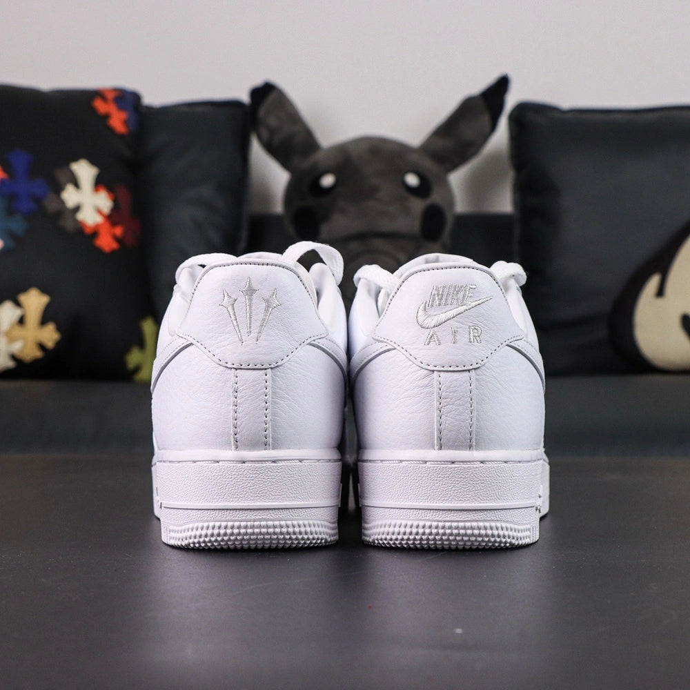 NOCTA x Air Force 1 Low Certified Lover Boy - pair overhead flat lay pink tongue lining