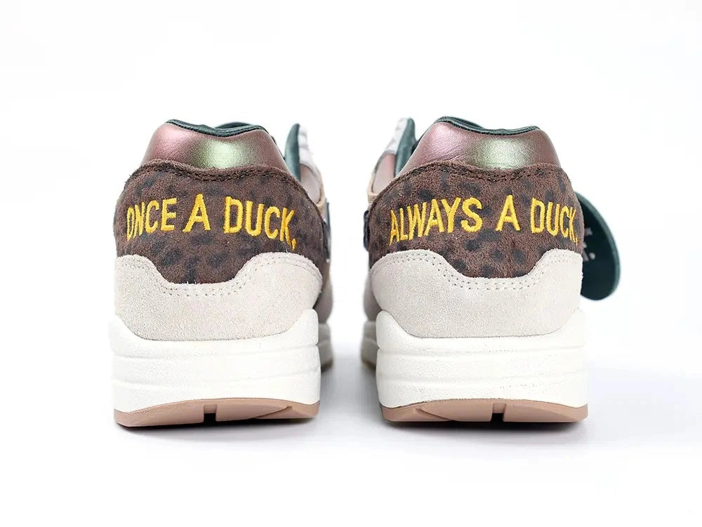 Air Max 1 87 Premium PE University of Oregon - Forefoot Toe Box Close Up on White Background Showing Desert Sand Suede Mudguard Dark Brown Corduroy Panel Leopard Print Underlayer and Teal Mini Swoosh on Suede