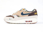 Air Max 1 87 Premium PE University of Oregon - Teal Mini Swoosh Close Up on Desert Sand Suede Medial Toe Box on White Background
