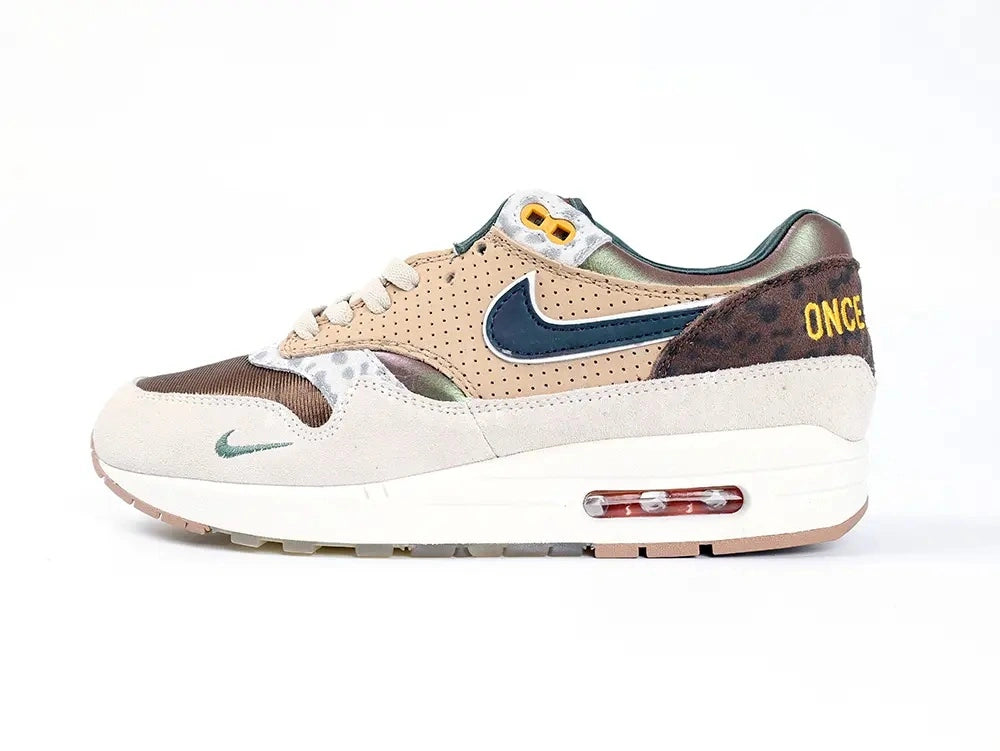 Air Max 1 87 Premium PE University of Oregon - Teal Mini Swoosh Close Up on Desert Sand Suede Medial Toe Box on White Background
