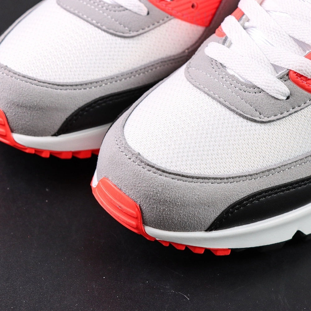 Air Max 90 Infrared 2020 - Pair Top Down View on Dark Background Showing White Mesh Toe Box Grey Suede Swoosh Infrared Red Collar Lining and White Flat Laces
