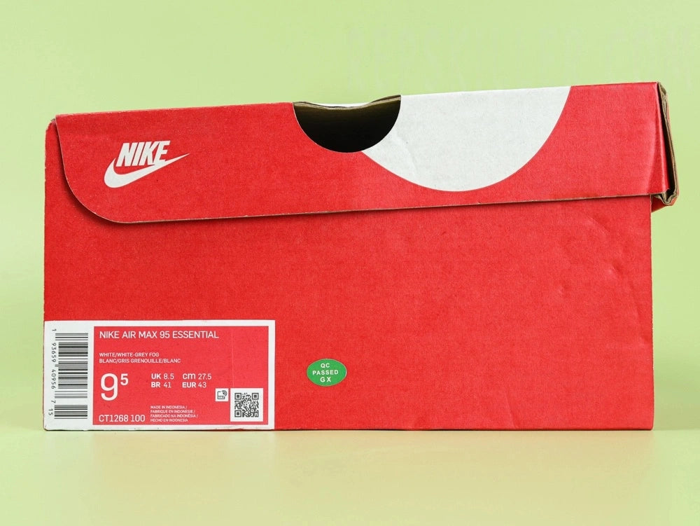 Air Max 95 Essential White Grey Fog - Lateral Toe Box Side View on Green Background Showing White Leather Mudguard White Mesh Quarter Panel and White Midsole with Translucent Forefoot Air Unit