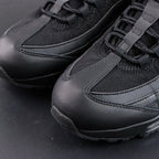 Air Max 95 OG Black Anthracite 2025 - Pair Top Down Angled View on Dark Background Showing Full Tonal Black Upper Black to Anthracite Gradient Spine Overlays and Silver Airmax Tongue Badge