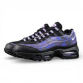 Air Max 95 OG Purple Camo 2025 - Lateral Full Side View with Red Shoebox on Sofa Showing Black Leather Toe Box Black Mesh Base Glossy Purple Camo Spine Overlays White Mini Swoosh and Purple Translucent Air Units