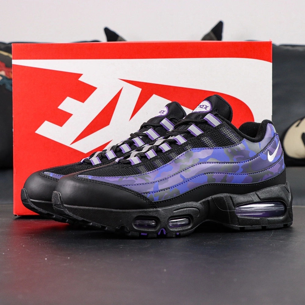 Air Max 95 OG Purple Camo 2025 - Toe Box Forefoot Close Up on Dark Background Showing Black Leather Mudguard Black Mesh Quarter Panel Purple Camo Forefoot Spine and Alternating White Purple Lace Loops
