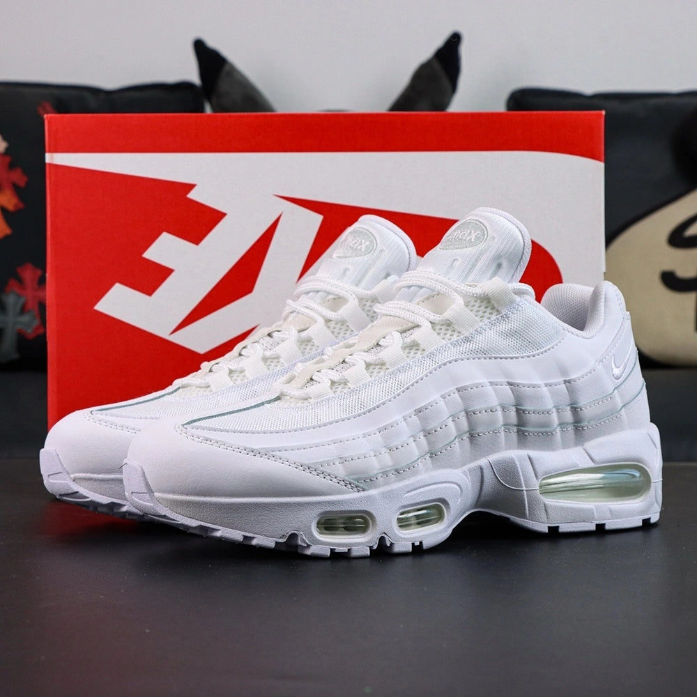 Air Max 95 OG White Pure Platinum 2025 - Single Lateral Full Side View with Pikachu on Sofa Showing Full White Upper White Leather Toe Box White Mesh Base Pure Platinum Gradient Spine Tonal White Swoosh and Clear Air Units