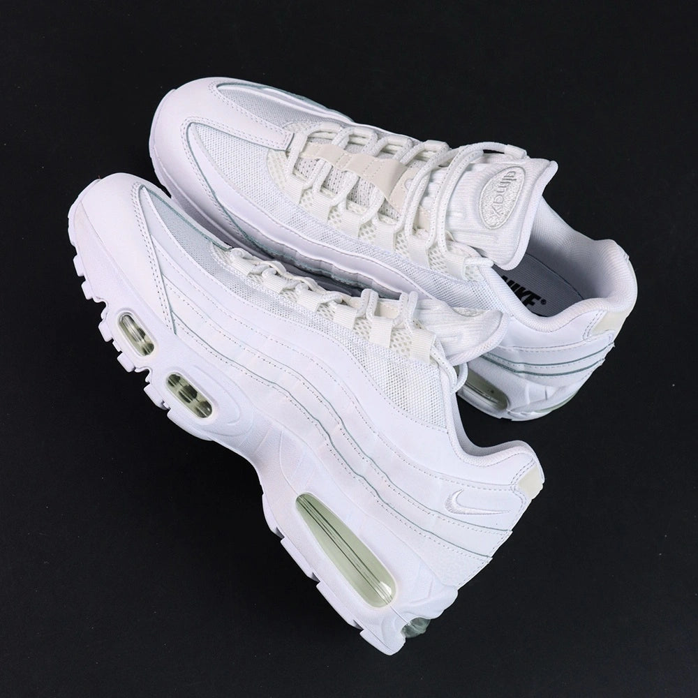 Air Max 95 OG White Pure Platinum 2025 - Pair Top Down Tongue Close Up on Dark Background Showing White Mesh Tongue with White Light Grey Oval Airmax Badge and Grey Air Max Black Swoosh Insole Graphic