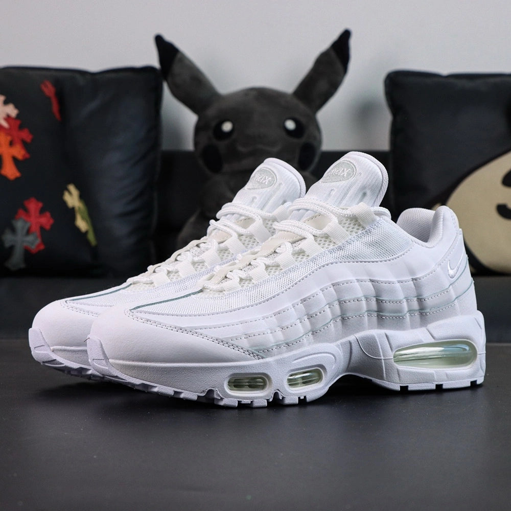 Air Max 95 OG White Pure Platinum 2025 - Single Lateral Full Side View with Pikachu on Sofa Showing Full White Upper Pure Platinum Gradient Spine Tonal White Swoosh White Midsole and Clear Air Units