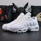 Air Max 95 OG White Pure Platinum 2025 - Single Lateral Full Side View with Pikachu on Sofa Showing Full White Upper Pure Platinum Gradient Spine Tonal White Swoosh White Midsole and Clear Air Units