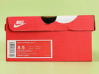 Air Max 95 TT Anatomy of Air - Toe Box Forefoot Close Up on Green Background Showing Medium Grey Grid Textured Suede Mudguard White Diamond Quilted Mesh Quarter Panel Light Pink Upper Spine and Sky Blue Tongue Lace Loop