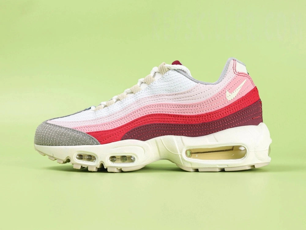 Air Max 95 TT Anatomy of Air - Outsole View on Green Background Showing Full Cream Sand AM95 Square Block Waffle Tread Outsole Central Translucent Window Revealing Pink Camouflage Print Insole with Nike Air Text and Translucent Yellow Tinted Heel Air Unit
