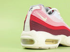 Air Max 95 TT Anatomy of Air - Tongue Close Up on Green Background Showing Deep Burgundy Wine Ribbed Fabric Tongue with Red Oval Airmax Badge Red Border and Pink Airmax Text
