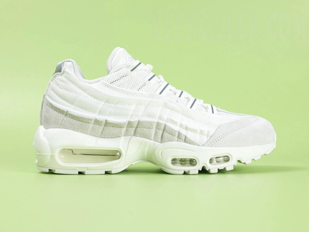 Air Max 95 x Comme des Garçons White - Toe Box Top Down View on Green Background Showing White Suede Mudguard White Mesh Upper and Reflective Grey Lace Dubrae Details