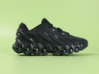 Air Max Dn8 All Black - Toe Box Top Down View on Green Background Showing Black Engineered Mesh Upper Black TPU Overlays and Tonal Black Swoosh on Lace Area