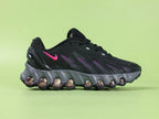 Air Max Dn8 Black Purple - Toe Box Top Down View on Green Background Showing Black Engineered Mesh Upper Black TPU Overlays and Hot Pink Swoosh Visible at Midfoot