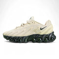 Air Max Dn8 Desert Khaki Black - Full Lateral Profile View on Green Background Showing Desert Khaki Bone Upper Black Mini Swoosh and Full Row of Large Black Spherical Dn8 Air Pods on Midsole
