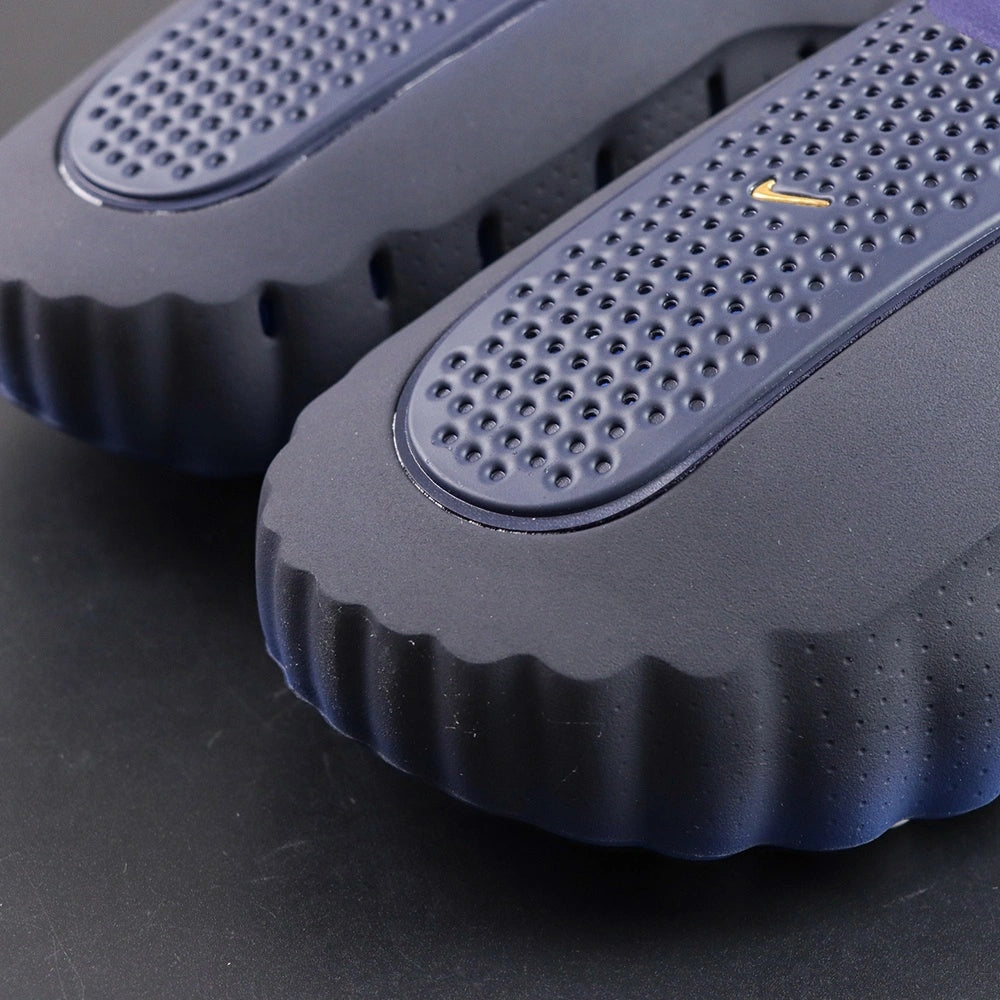 Mind 001 Blackened Blue 2026 - Side profile gold Swoosh pair
