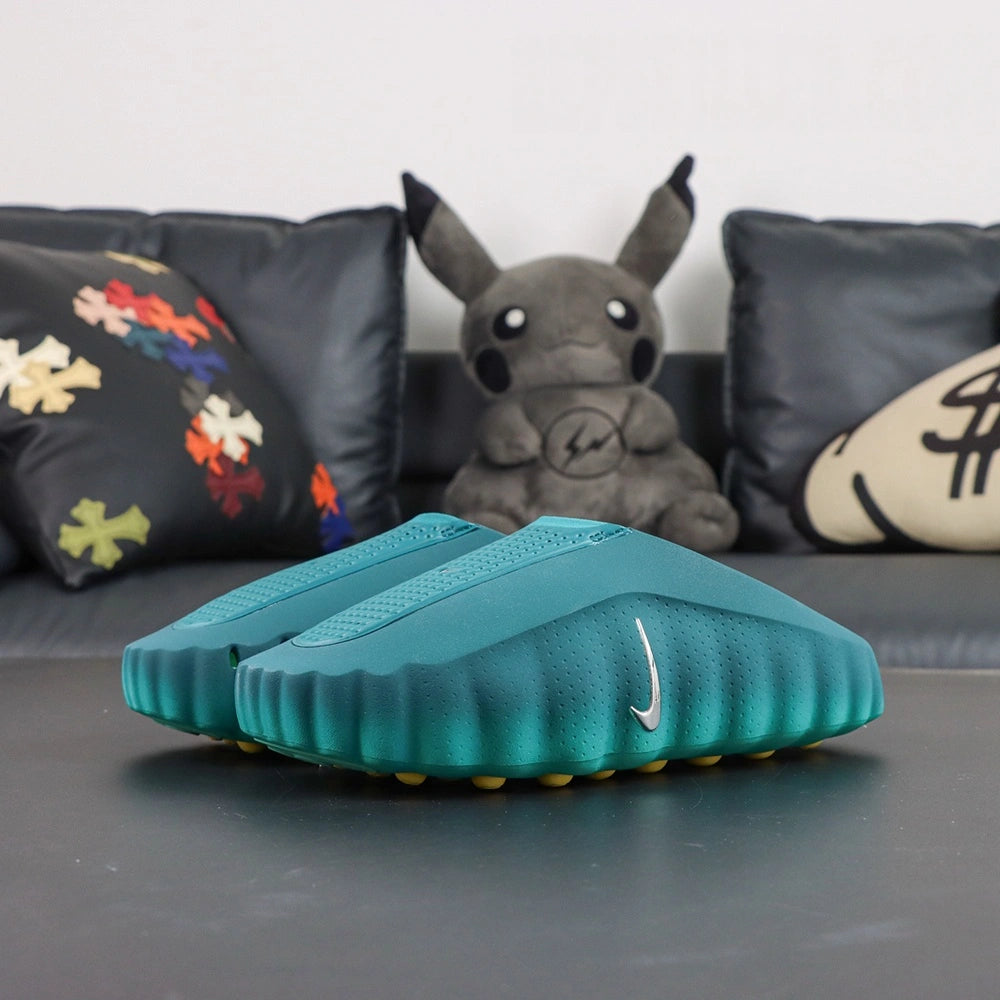 Mind 001 Geode Teal 2026 - Heel toe front view with Pikachu backdrop