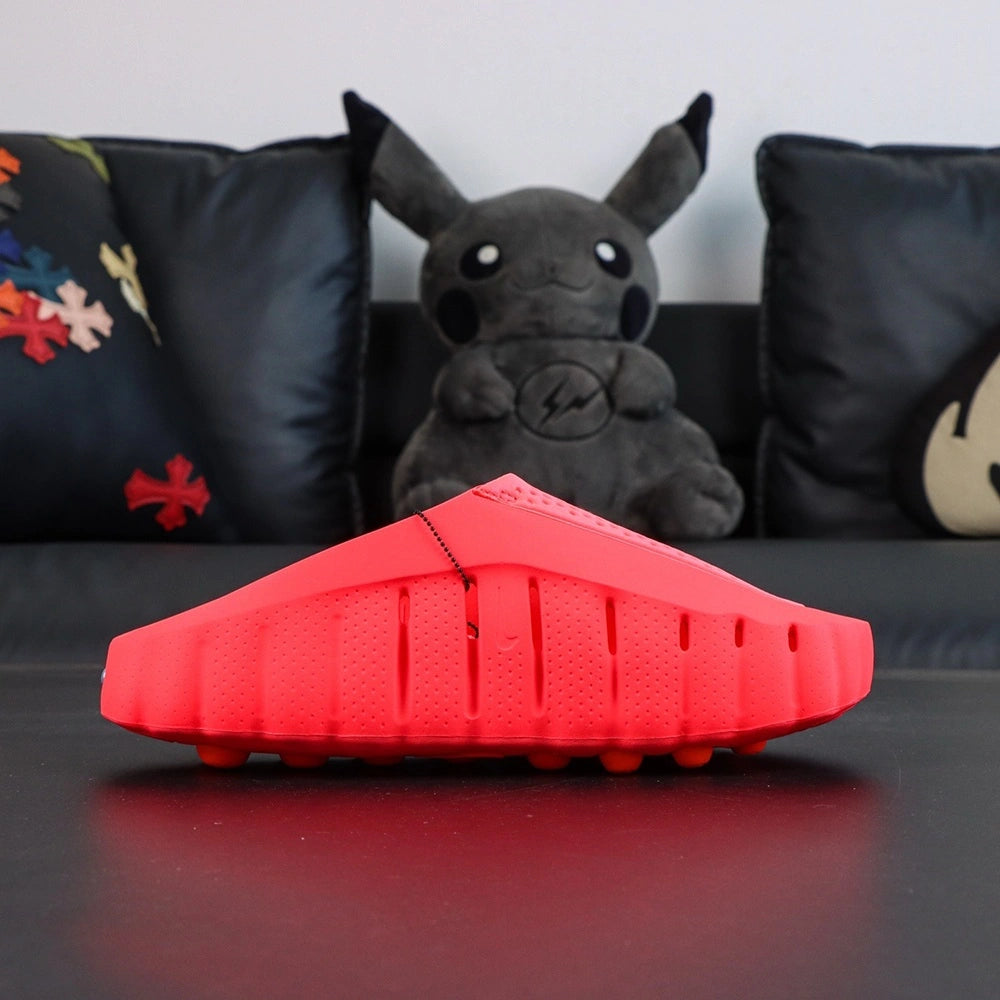 Mind 001 Mule Solar Red 2026 - Outsole orange bubble pods pair with Pikachu backdrop