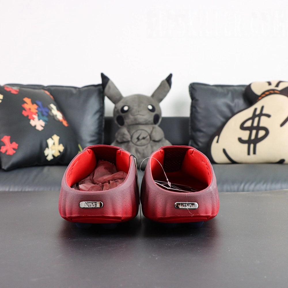 Mind 001 Mule Team Red 2026 - Front toe view silver Swoosh with Pikachu backdrop