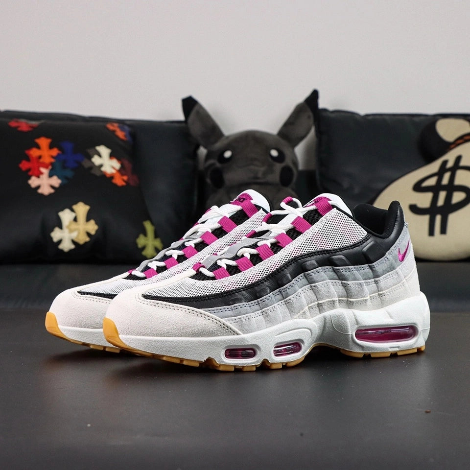 SB x Air Max 95 Cactus Flower - Toe Box Close Up on Black Background Showing White Suede Mudguard Light Grey Suede Lower Spine White Large-Hole Mesh Quarter Panel and Cactus Flower Lace Keeper Tabs