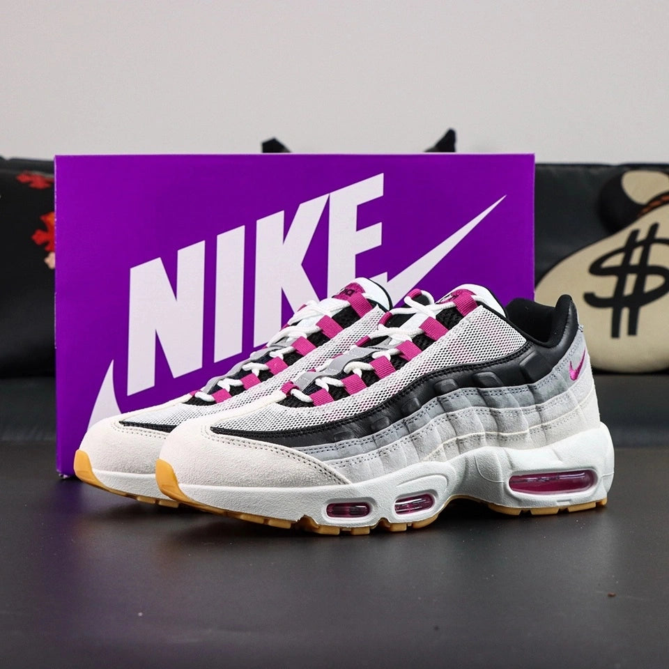 SB x Air Max 95 Cactus Flower - Heel Three-Quarter Rear View on Grey Background Showing Cactus Flower Embroidered Mini Swoosh NIKE SB and AIR Co-Branding on Black Leather Heel Counter and Cactus Flower Air Unit at Heel