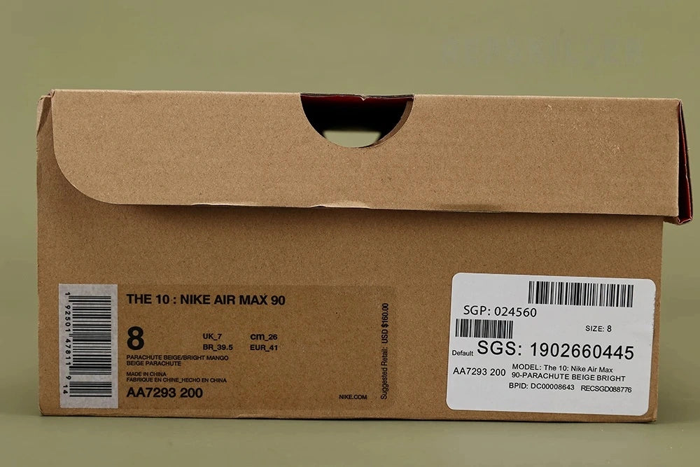 Off-White x Air Max 90 Desert Ore - Toe Box Close Up on Olive Background Showing Sand Diamond-Grid Ripstop Mesh Upper Sand Suede Mudguard Raw Unfinished Overlay Edges and Hot Coral Overlock Stitching