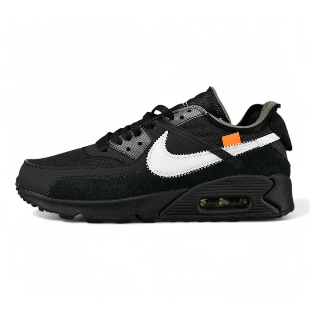 Off-White x Air Max 90 Black - Three-Quarter Lateral View of Both Shoes on Olive Background Showing Triple Black Upper White Raw-Edge Swoosh Orange Zip-Tie and Light Blue Heel Zip-Tie with White Laces Bag