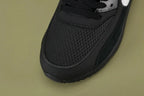 Off-White x Air Max 90 Black - White Laces Close Up on Olive Background Showing Additional White Flat Laces with Orange LACES Text in Plastic Bag and Light Blue Zip-Tie Hangtag