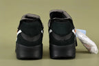 Off-White x Air Max 90 Black - Full Lateral Profile View on Olive Background Showing Triple Black Ripstop Mesh Suede Upper White Raw-Edge Swoosh Orange Square Woven Tab on Tongue and Black AM90 Midsole