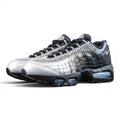Palace x Air Max 95 Big Bubble Metallic Silver 2026 - Full Lateral Profile View on Dark Background Showing Metallic Silver Perforated Leather Toe Box Black Smooth Leather Spine Overlays Palace Oval Tongue Badge and Ice Blue Big Bubble Air Units