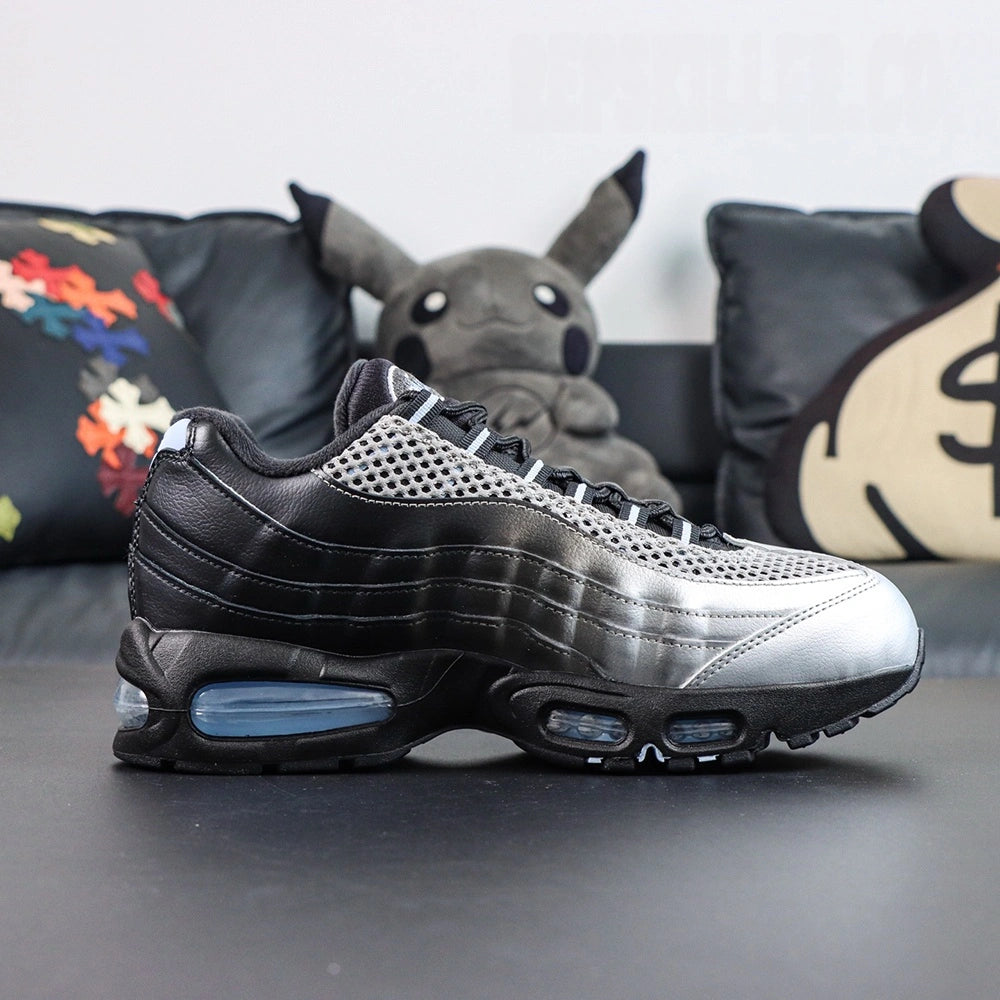 Palace x Air Max 95 Big Bubble Metallic Silver 2026 - Toe Box Close Up on Dark Background Showing Metallic Silver Perforated Leather Toe Box Silver Large-Hole Mesh Quarter Panel and Black Smooth Leather Spine Overlay Edge