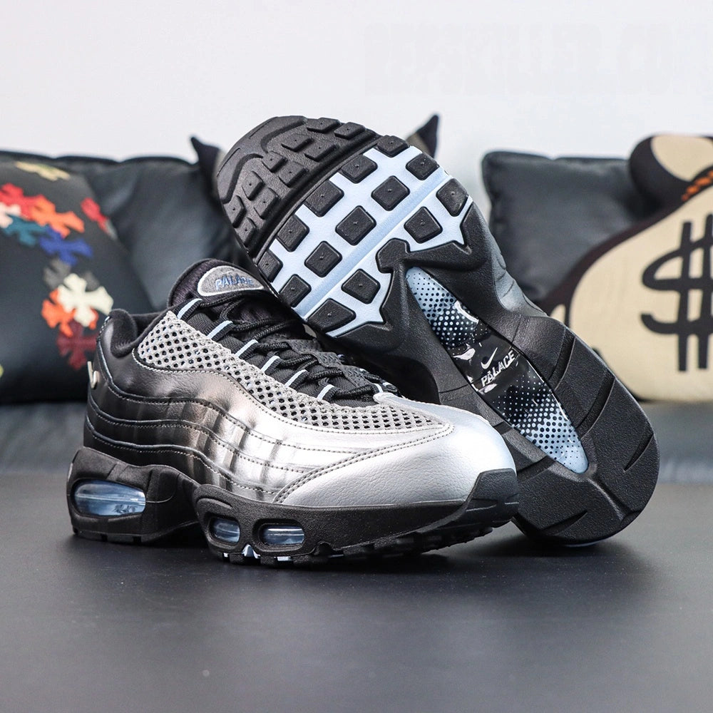 Palace x Air Max 95 Big Bubble Metallic Silver 2026 - Three-Quarter Lateral View of Both Shoes on Dark Background Showing Full Metallic Silver and Black Upper Construction Ice Blue Big Bubble Air Units and Black-White Square-Block Outsole