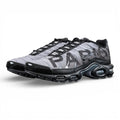 Paris Saint-Germain x Air Max Plus Black Particle Grey - Full Lateral Profile View on Dark Background Showing Black Patent Leather TN Upper Particle Grey Hex Mesh with Black PSG Lettering Black Mini Swoosh and Yellow Tn AIR Heel Badge