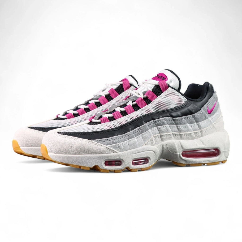 SB x Air Max 95 Cactus Flower - Toe Box Close Up on Dark Background Showing White Suede Mudguard White Large-Hole Mesh Quarter Panel Cactus Flower Fuchsia Grosgrain Ribbon Lace Tabs and Honey Gum Outsole