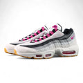 SB x Air Max 95 Cactus Flower - Toe Box Close Up on Dark Background Showing White Suede Mudguard White Large-Hole Mesh Quarter Panel Cactus Flower Fuchsia Grosgrain Ribbon Lace Tabs and Honey Gum Outsole