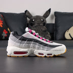 SB x Air Max 95 Cactus Flower - Full Lateral Profile View on Dark Background Showing White Grey Gradient Suede AM95 Upper Cactus Flower Fuchsia Mini Swoosh Fuchsia Grosgrain Lace Tabs and Fuchsia Air Unit at Forefoot