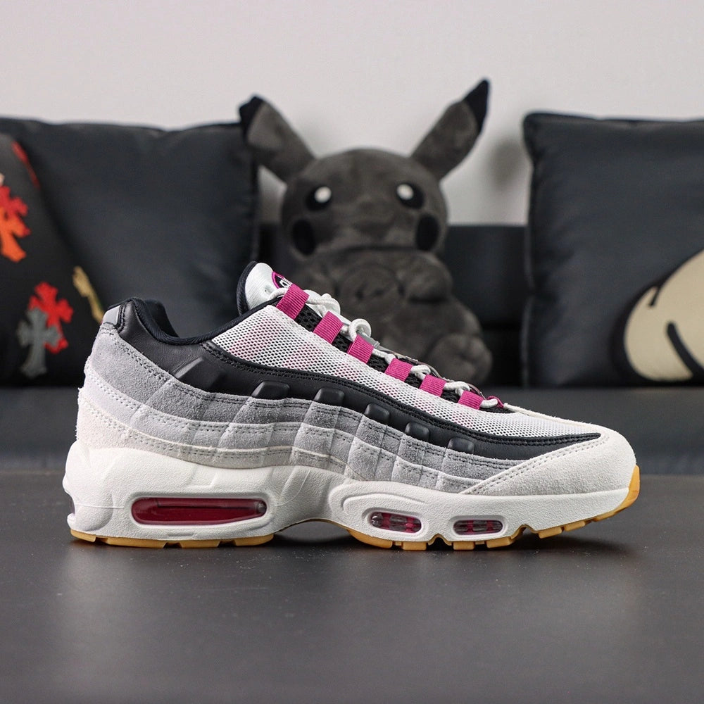 SB x Air Max 95 Cactus Flower - Full Lateral Profile View on Dark Background Showing White Grey Gradient Suede AM95 Upper Cactus Flower Fuchsia Mini Swoosh Fuchsia Grosgrain Lace Tabs and Fuchsia Air Unit at Forefoot