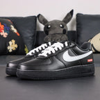 Supreme x Air Force 1 Low Box Logo Black White White Laces - pair three quarter view white Swoosh red Supreme badge Pikachu