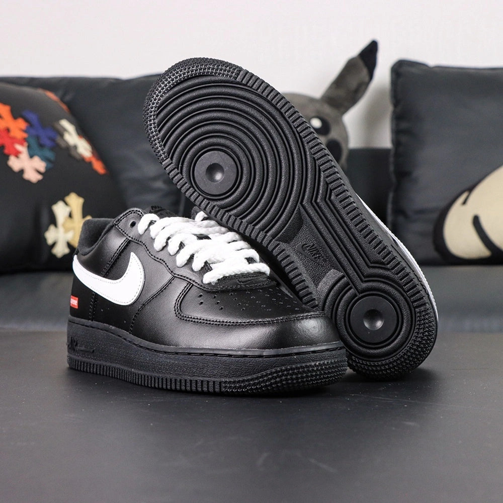 Supreme x Air Force 1 Low Box Logo Black White White Laces - pair three quarter view white laces black outsole Pikachu