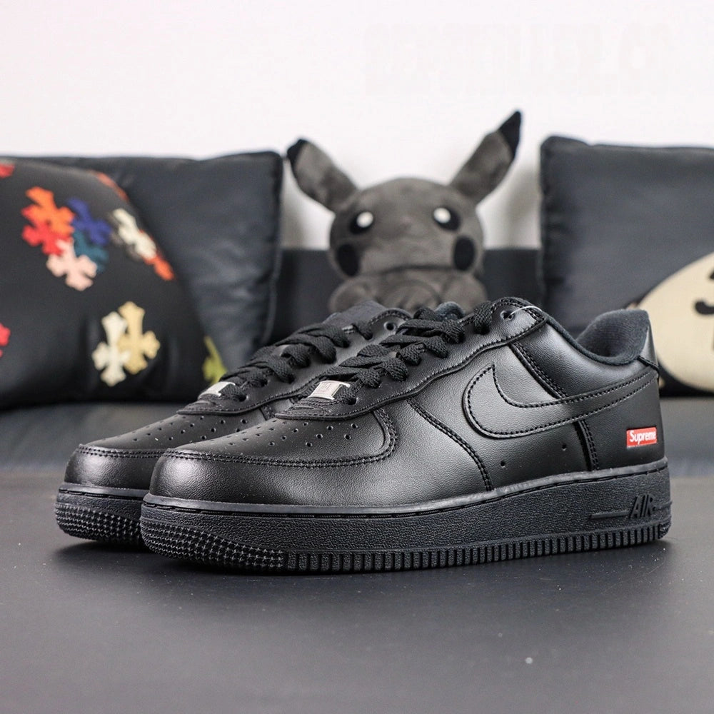Supreme x Air Force 1 Low Box Logo Black 2020 - pair three quarter view black outsole Pikachu