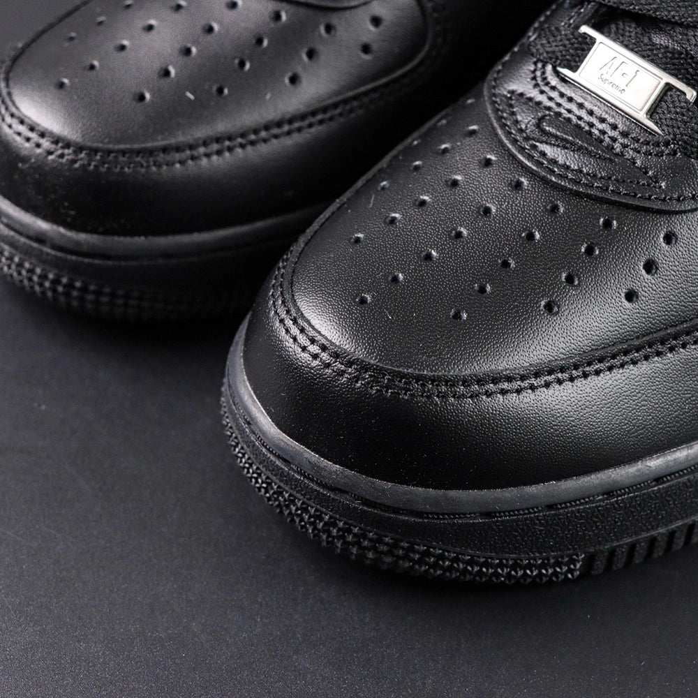 Supreme x Air Force 1 Low Box Logo Black 2020 - pair three quarter view lateral Supreme badge Pikachu